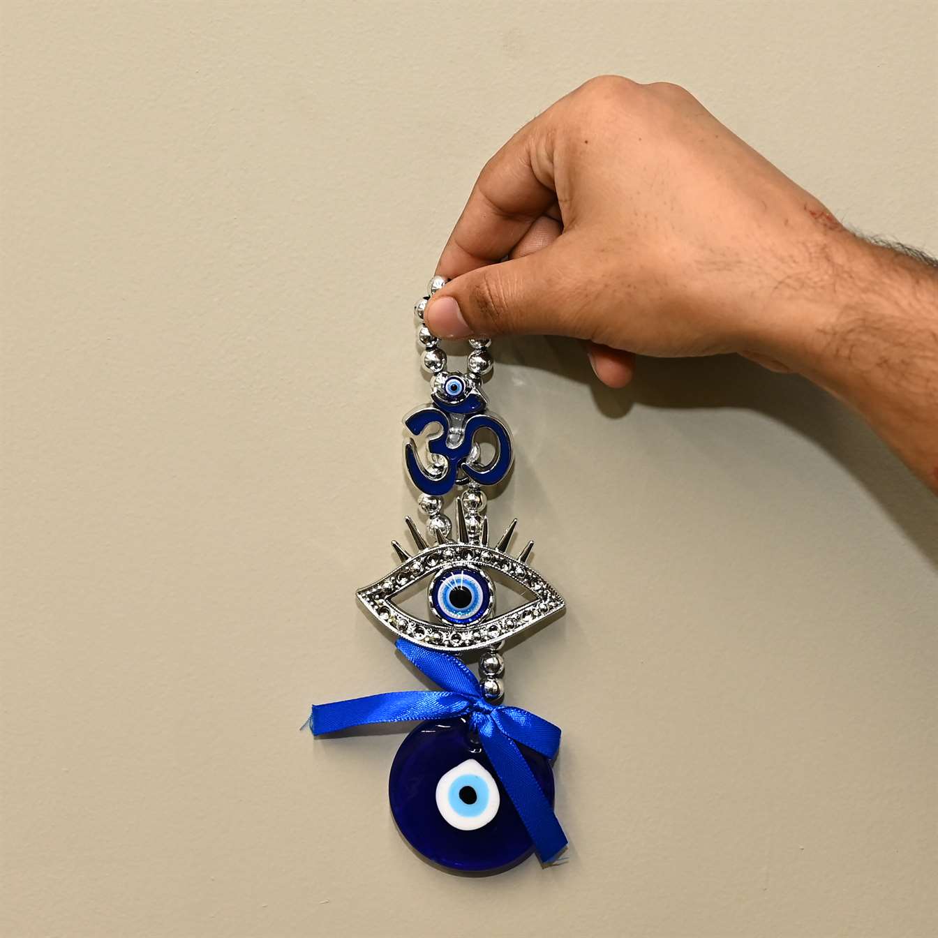 Metal Om Design Evil Eye Wall Hanging with Blue Pendant